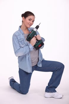 Woman with a cordless drill/screwdriver
