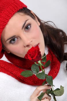 Woman holding red rose