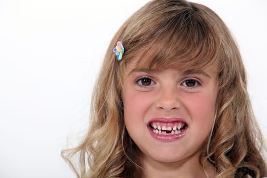 Little girl baring her teeth