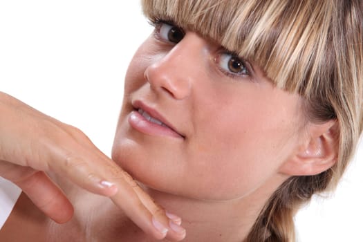 man touching blond woman's chin