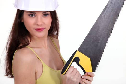 Young woman with a saw