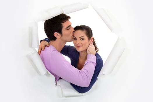 A man kissing his wife