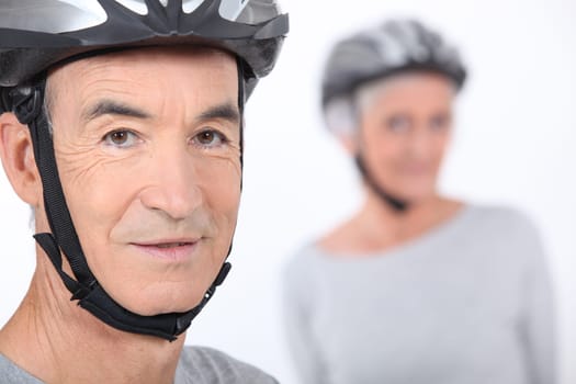 Senior man with a bicycle helmet