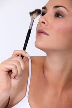 Woman with make-up brush