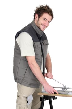 Man with a tile cutter