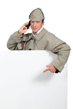 Man dressed in detective costume