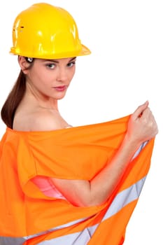 sexy female construction worker undressing