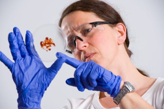 woman in laboratory with object holder
