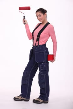 Woman in overalls ready for painting