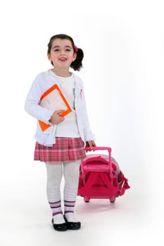 Smiling schoolgirl with trolley