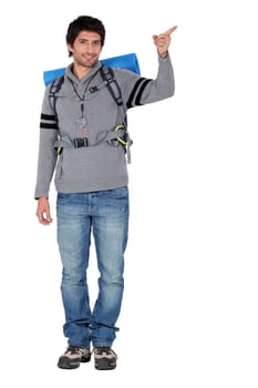 Backpacker pointing the way