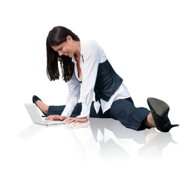 Young business woman in gymnastics pose working with computer - isolated on white