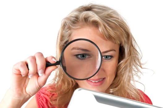 Woman with magnifying glass and digital tablet