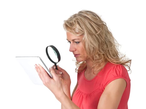 Woman with digital tablet and magnifying glass