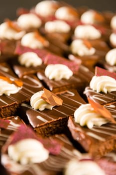 Decorative chocolate desserts with whipped cream ornament