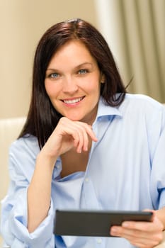Confident smiling woman with digital tablet
