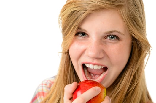 Teenage girl eating healthy apple isolated on white background