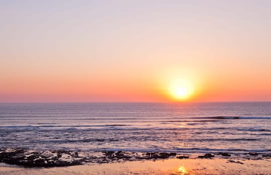 Sunset on Atlantic coast of Portugal at Praia da Areia Branca
