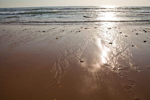 Sunset on Atlantic coast of Portugal at Praia da Areia Branca