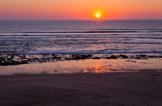 Sunset on Atlantic coast of Portugal at Praia da Areia Branca