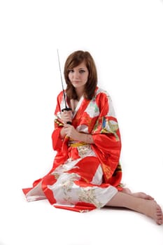 french young girl geisha in red silk kimono with japanese sword