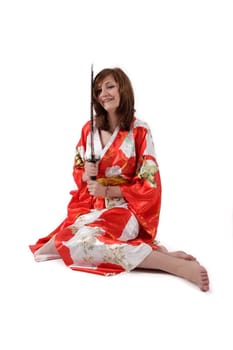french young girl geisha in red silk kimono with japanese sword
