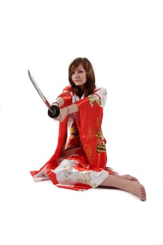french young girl geisha in red silk kimono with japanese sword