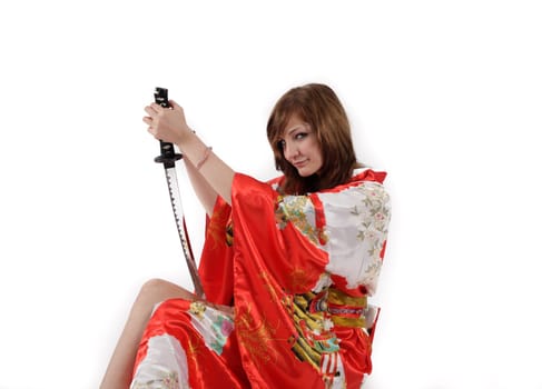 french young girl geisha in red silk kimono with japanese sword