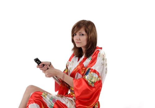 french young girl geisha in red silk kimono with japanese sword