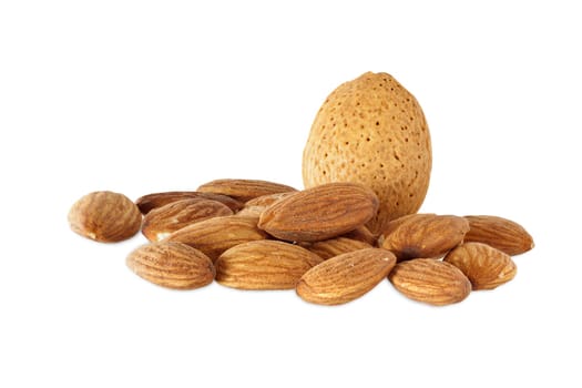 Many almond kernels and a whole almond isolated against a white background
