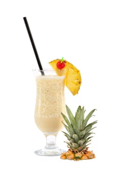 Pina Colada cocktail with pineapple piece,cocktail cherry and straw insulated against a white background