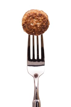 White cut-off meatball on a fork