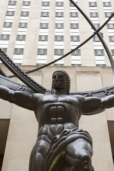 NEW YORK CITY - SEP 22: Atlas is a bronze statue in front of Rockefeller Center in midtown Manhattan. Atlas in the sculpture is 15 feet tall, while the entire statue is 45 feet tall,[1][2] as high as a four-story building. It weighs seven tonsSeptember 22, 2012  in Manhattan, New York City.
