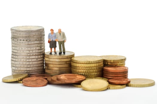 Model figures of senior couple with euro coins