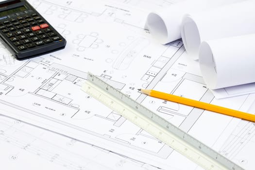 Blueprint of architecture, calculator, pencil and scale ruller