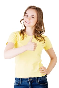 beautiful teen woman in casual clothes gesturing thumbs up. isolated