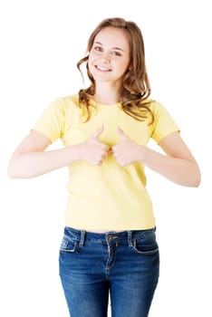 beautiful teenage girl in casual clothes gesturing thumbs up. isolated