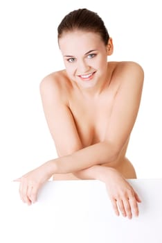 sexy naked blond woman holding empty board,isolated on white.