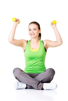 fitness girl is working out with dumbbells,isolated on white background