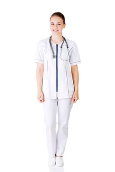 nurse or young doctor standing smiling. isolated on white background. full body