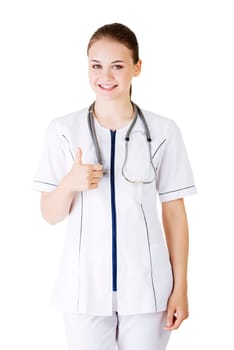 young female doctor or nurse gesturing ok,isolated on white.