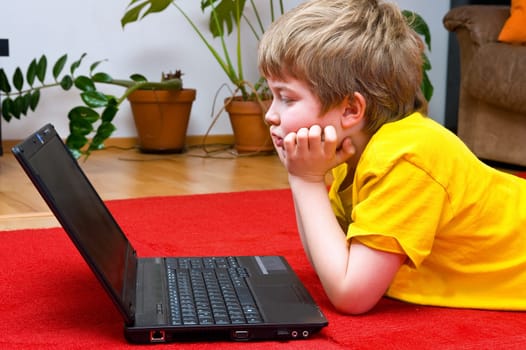 boy with computer at home