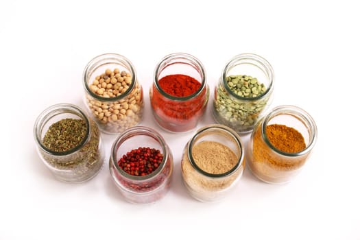 Variety of spices in a glass pot.