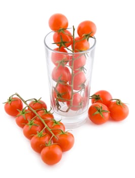 Small cocktail tomatoes in a glass isolated, fresh vegetables