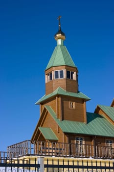 Christian church against the blue sky and clouds
