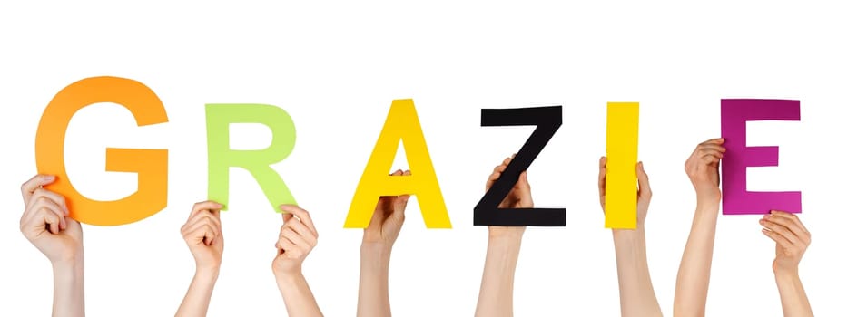 many hands holding the italian word grazie which means thanks, isolated