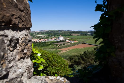 View to Sanctuary of the Lord Jesus da Pedra church from Obidos Castle wall in Leiria district of Portugal