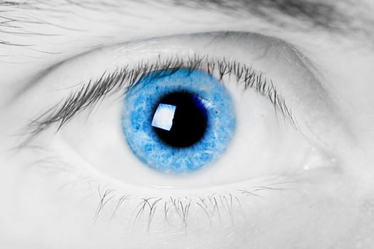 open blue eye men. Close-up with bright light