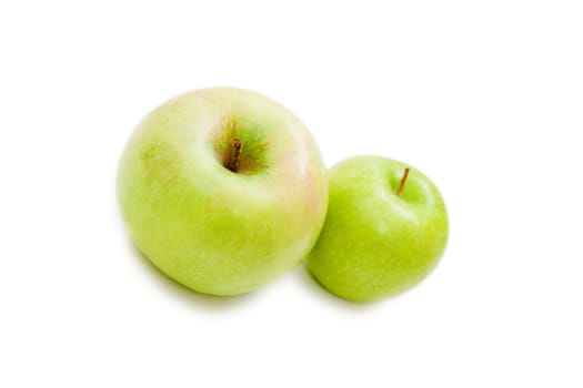 two juicy green apple on a white background