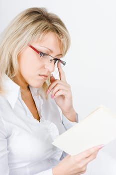 young attractive blonde with glasses and a book